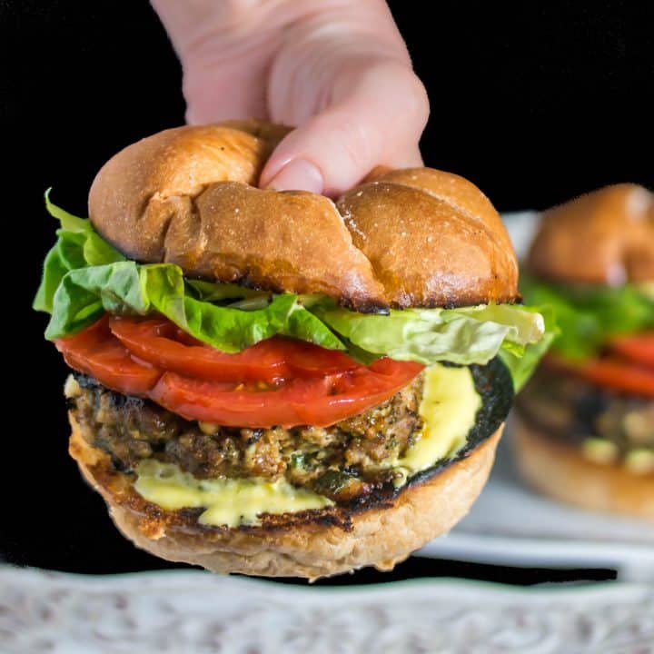 Super Healthy Turkey Burgers With Blood Orange Aioli in a bun in my hand!