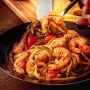 15 Minute Shrimp Zoodles Turkish Style - a fork in a bowl of shrimp zoodles - square image.
