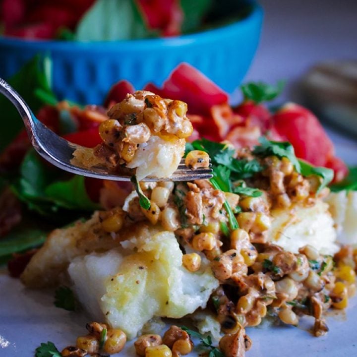 Baked cod with corn relish topped with pine nuts and corn.
