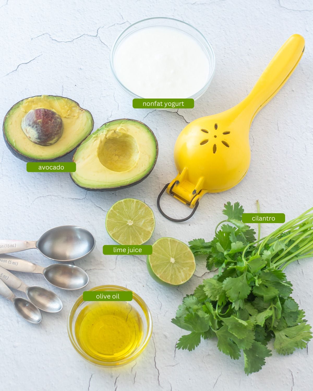 Ingredients for the avocado crema - avocado, yogurt, cilantro, lime, olive oil.