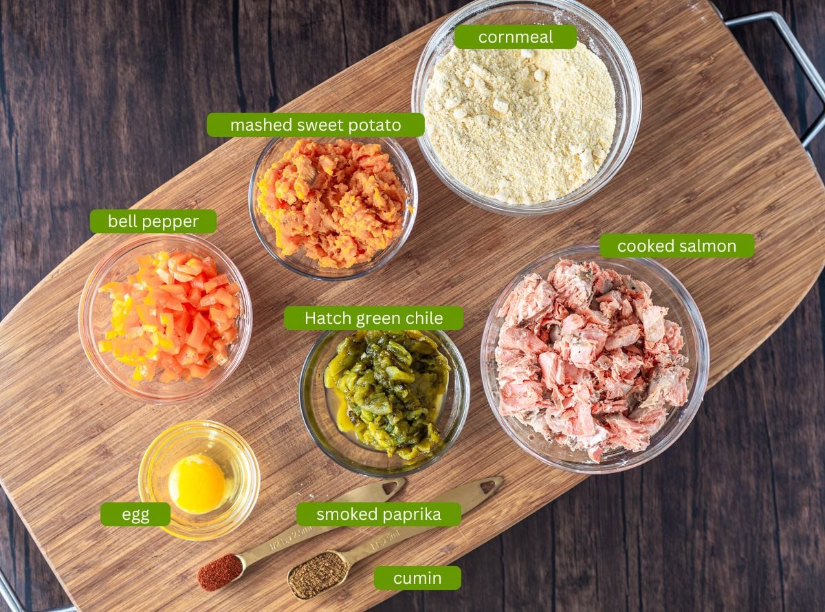 Ingredients for Hatch chile salmon cakes including flaked salmon, Hatch green chile, and sweet potatoes.
