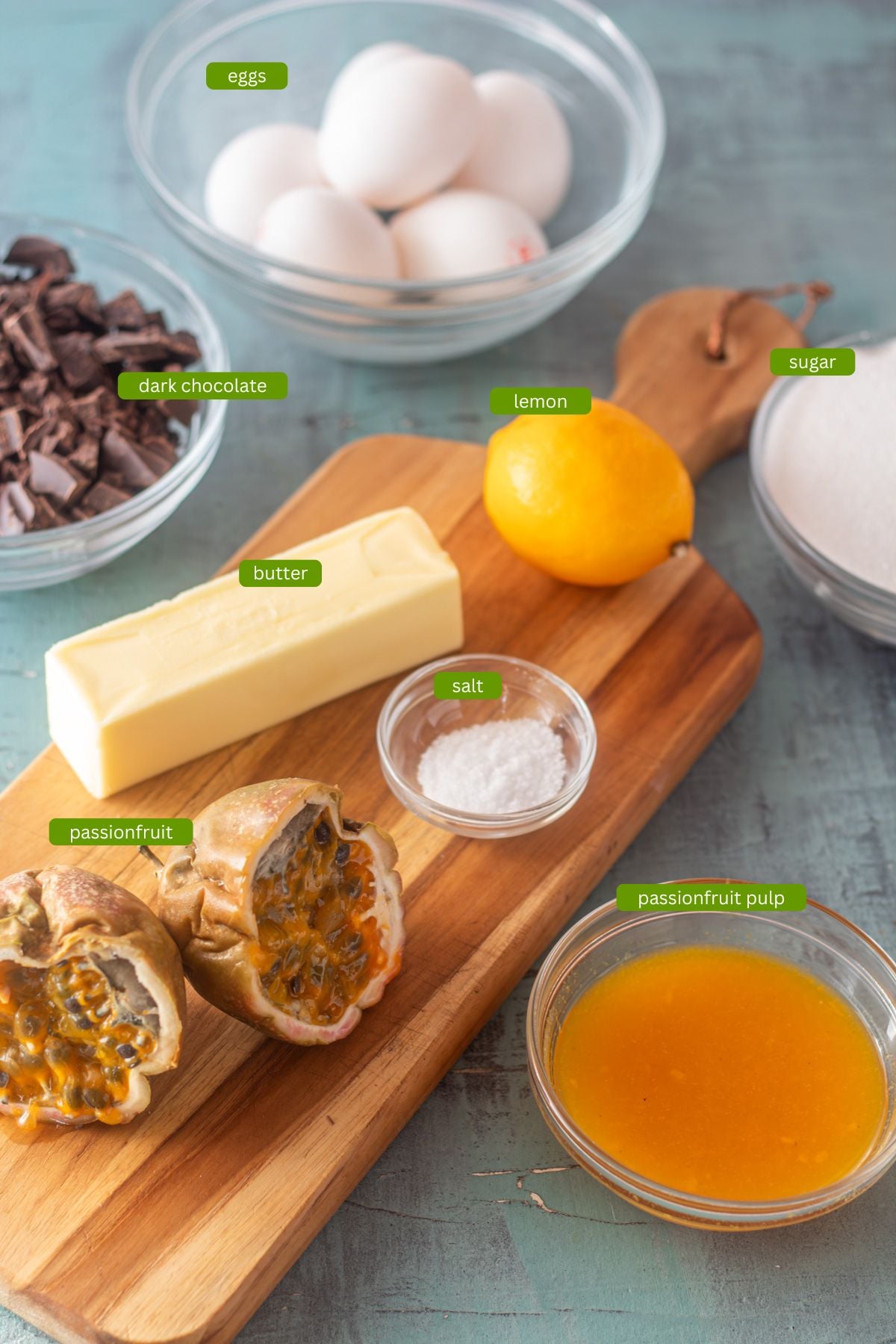 Ingredients for the passionfruit dark chocolate dessert: Eggs, sugar, salt, passionfruit puree, butter, chocolate.