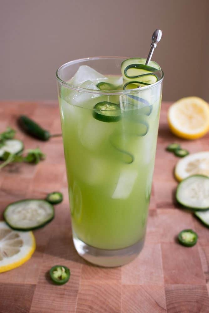 A spicy cucumber cocktail in a highball glass.