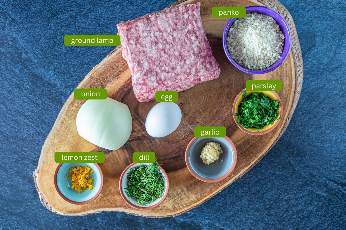 Ingredients for the Greek meatballs including ground lamb, herbs, lemon zest, egg, and panko.