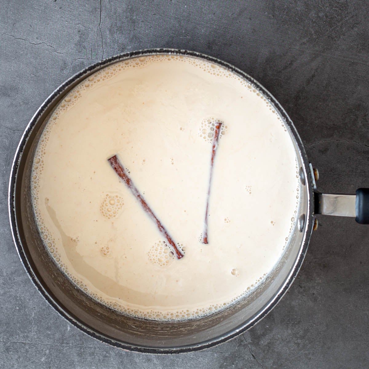 Step 1 - Steep the cinnamon stick with the cream, sea salt, and sugar over medium heat.