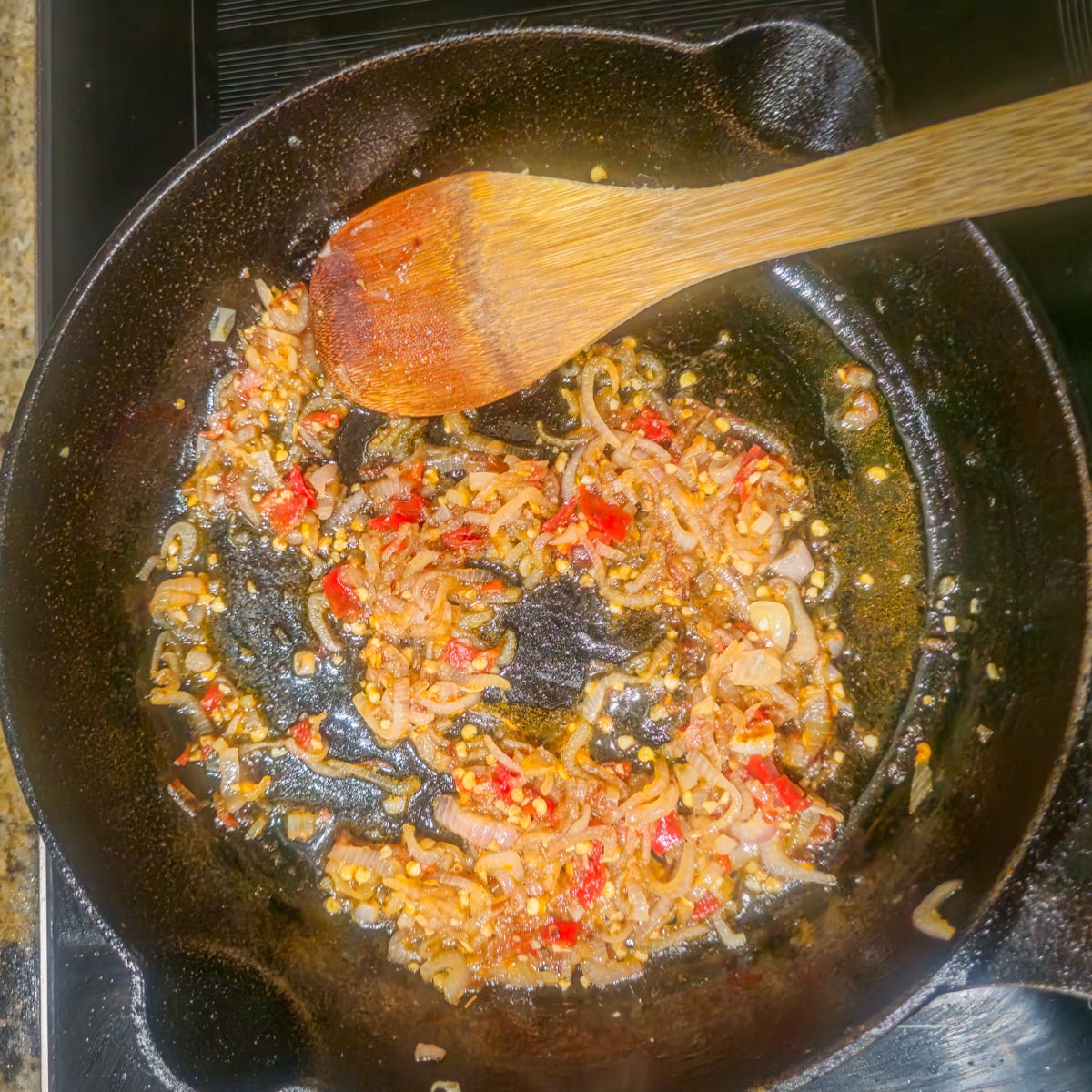 Step 3 - Shallots, garlic, and pepper are saut&eacute;ed in a cast iron skillet.
