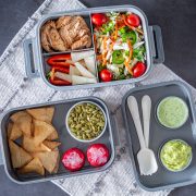 3 trays from a grey bento box with components of a Mexican box lunch.