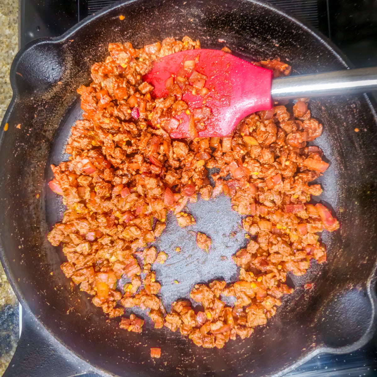 Step 3 - The bison mixture is stirred until fragrant in the cast iron skillet.