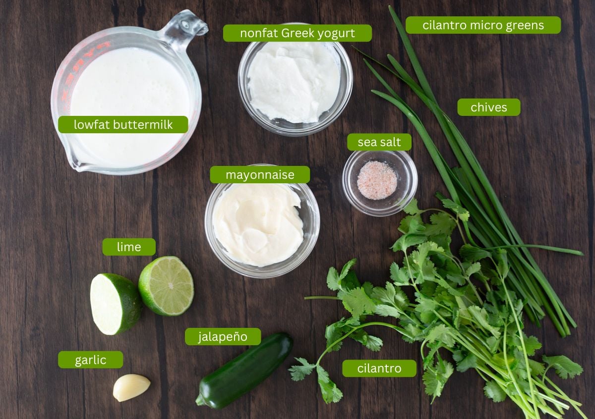 Ingredients for cilantro lime ranch dressing including buttermilk, cilantro, lime, and mayonnaise.