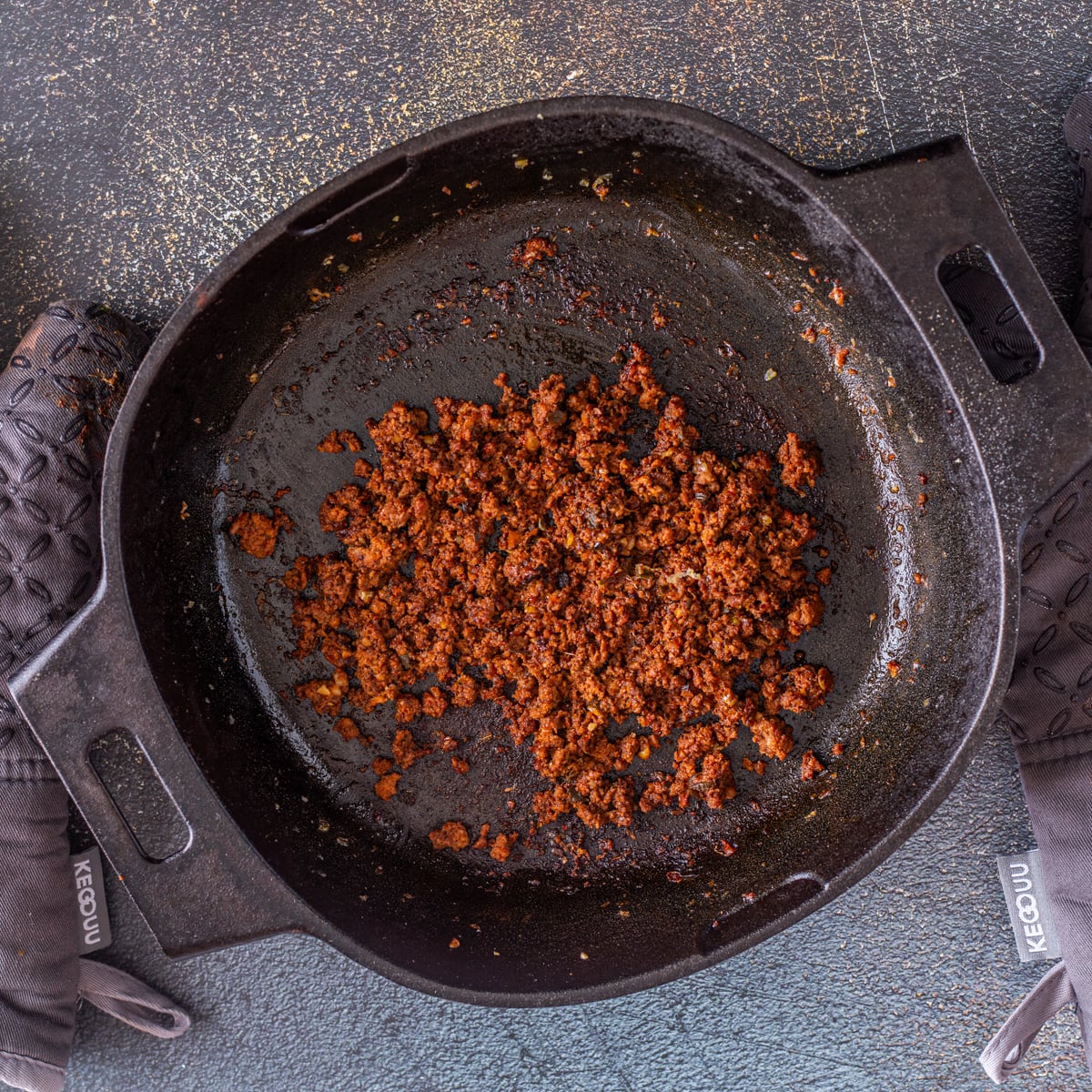 Step 2 - The lean chorizo is browned in the cast iron skillet.