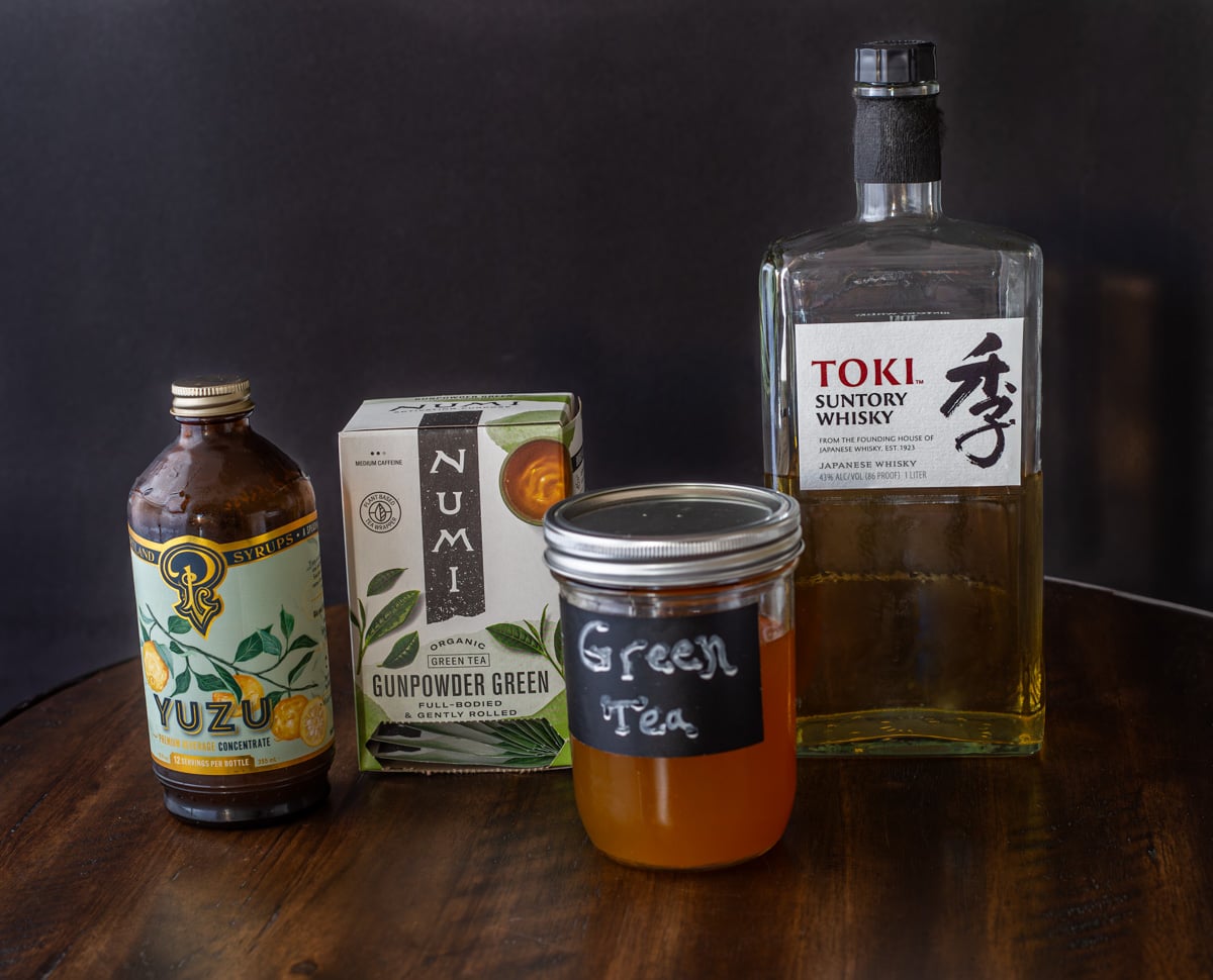 Ingredients for the whisky and green tea cocktails: Suntori whisky, strong green tea, and yuzu syrup.