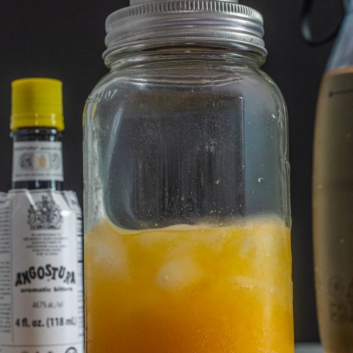 Passionfruit and Pisco in a mason jar cocktail shaker.
