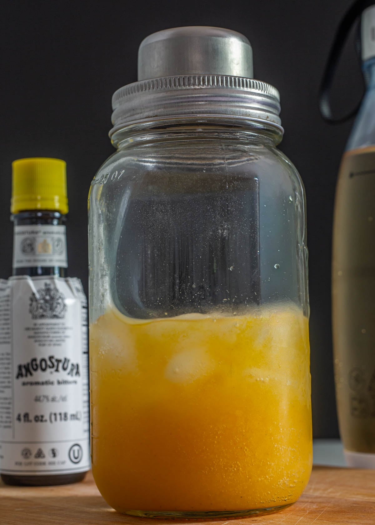 Passionfruit and Pisco in a mason jar cocktail shaker.