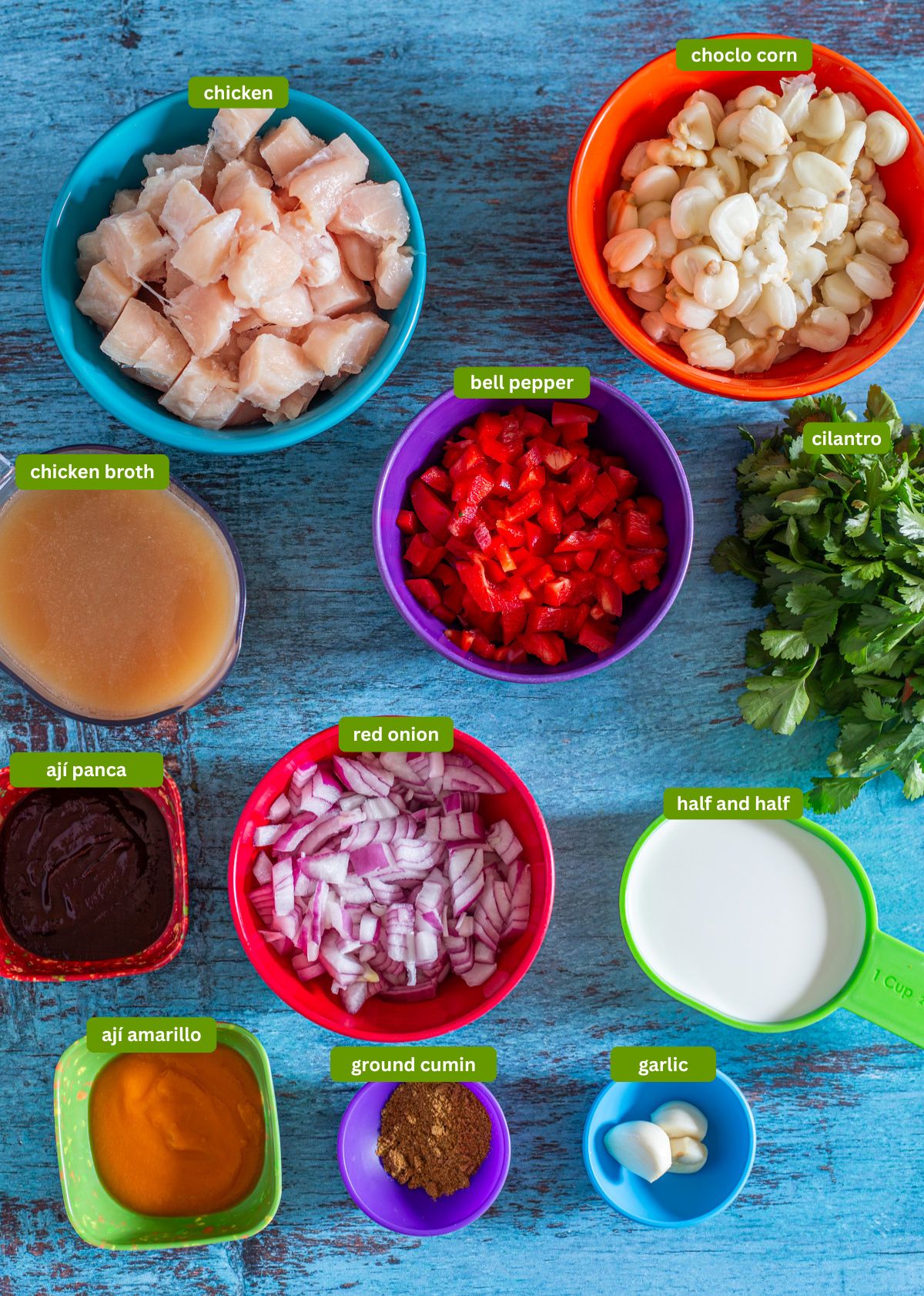 Ingredients for pep&iacute;an de choclo including choclo corn, chicken, aj&iacute; panca and amarillo, etc.