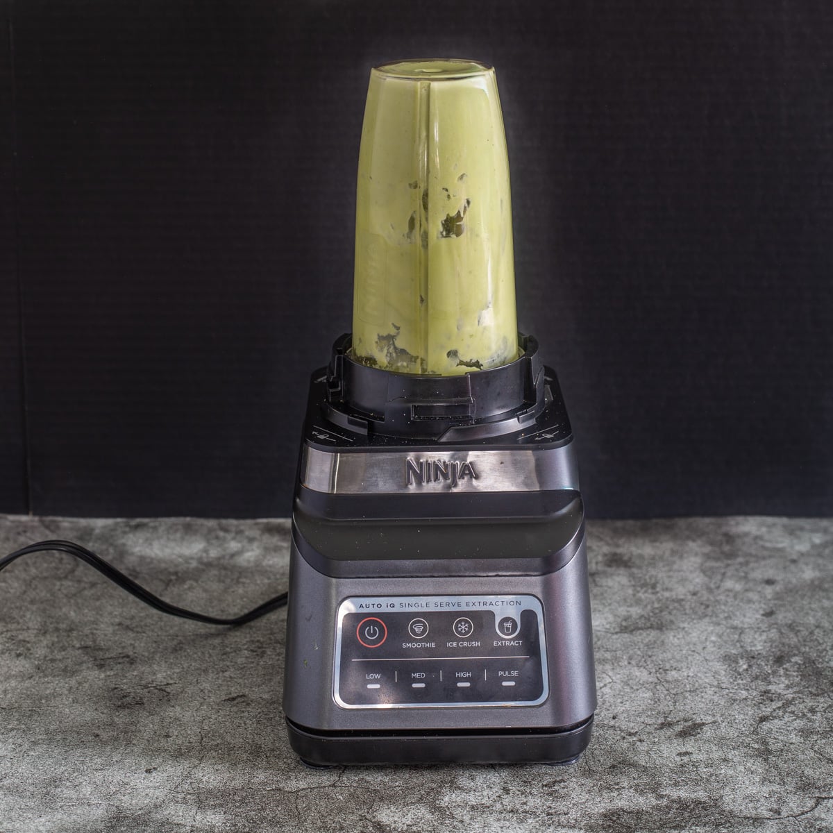 Ingredients for the coconut avocado coulis in a Ninja blender.