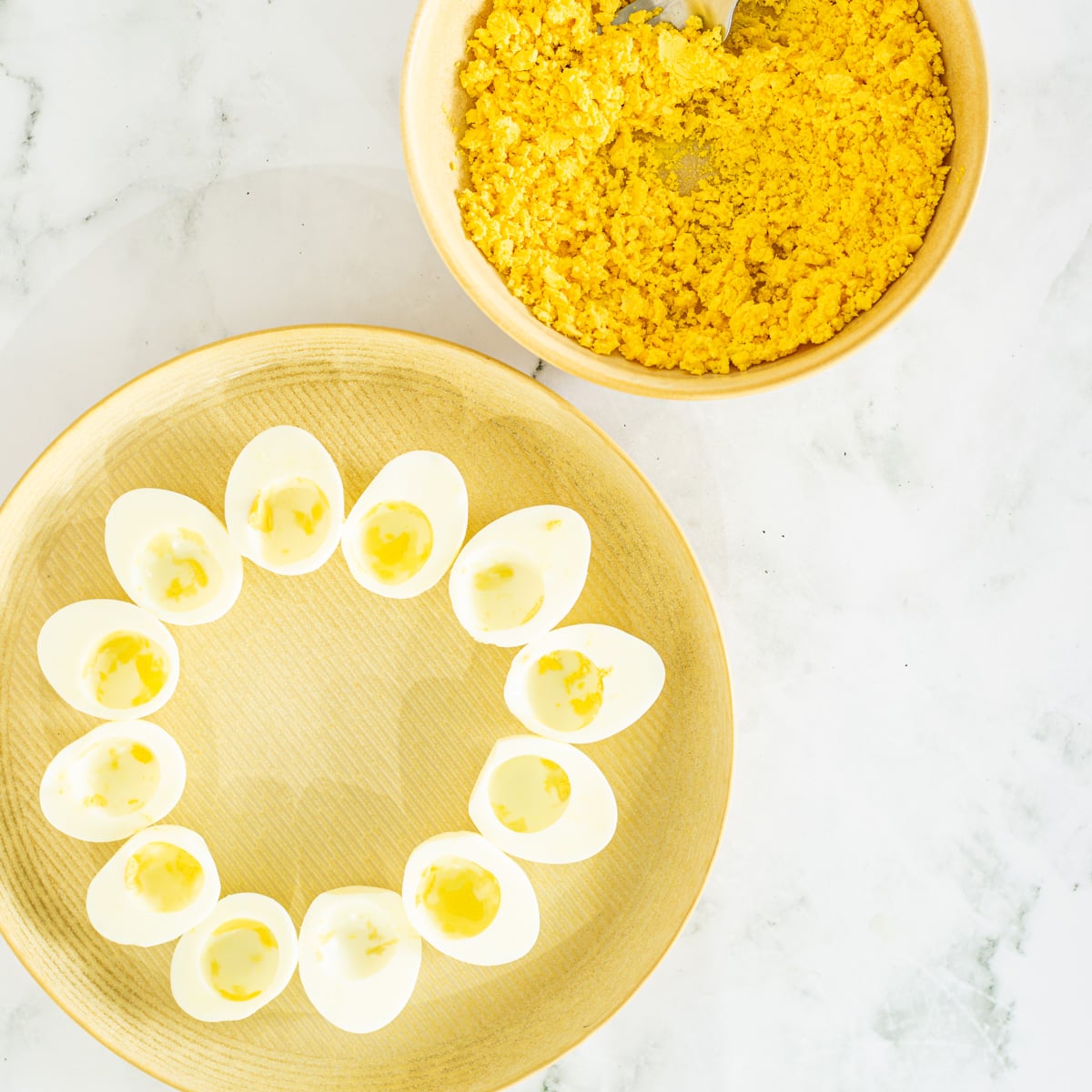 The egg yolks are separated from the egg whites for the Mexican deviled eggs.
