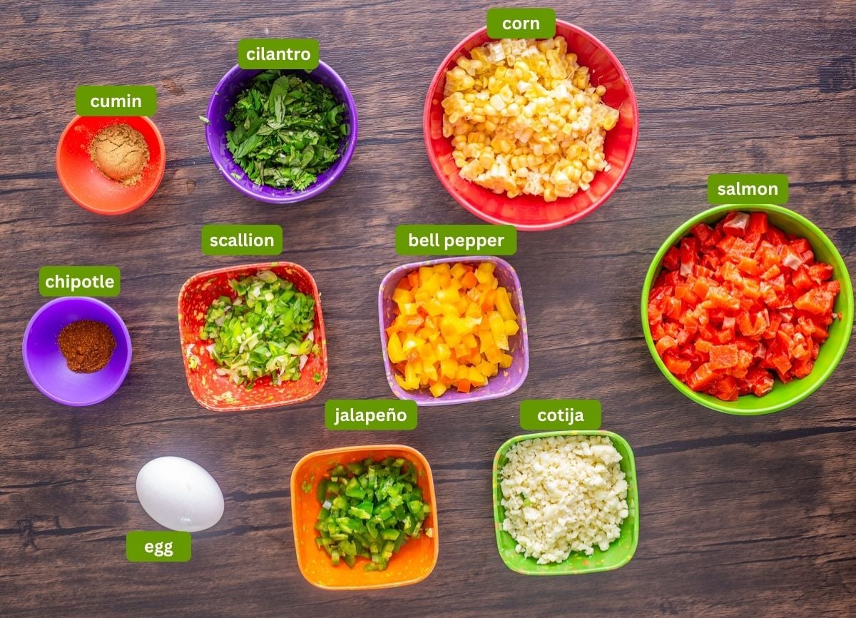 Ingredients for spicy Mexican salmon patties including sockeye salmon, veggies, and spices.