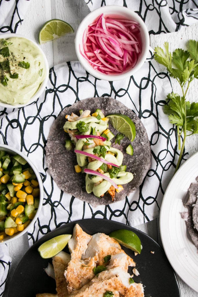 Tequila and Lime Fish Tacos with quick pickled onions.