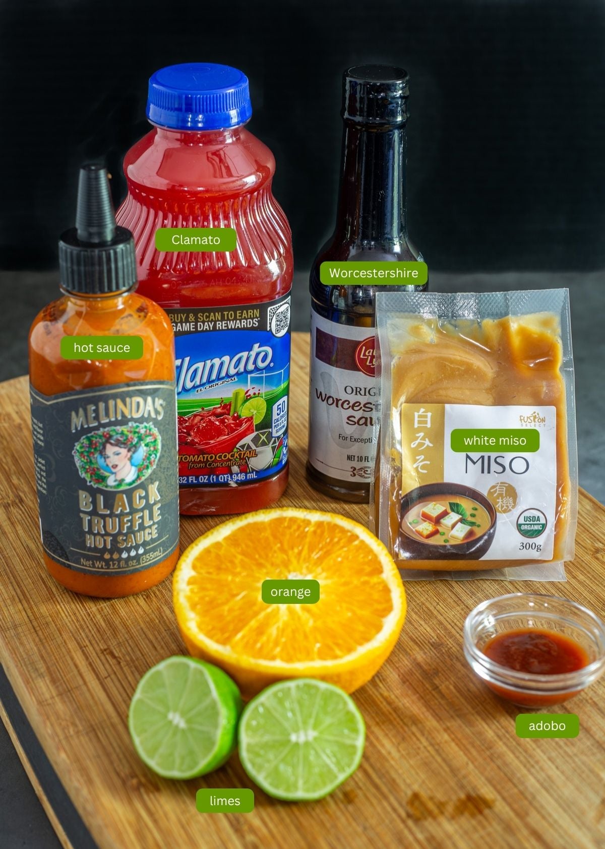 Ingredients for the miso michelada mix including white miso, chipotle adobo, Clamato, citrus, and hot sauce.