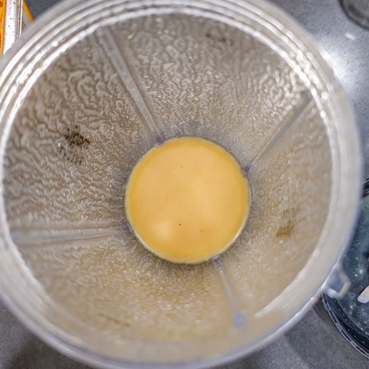 A blender with miso and warm water emulsified.