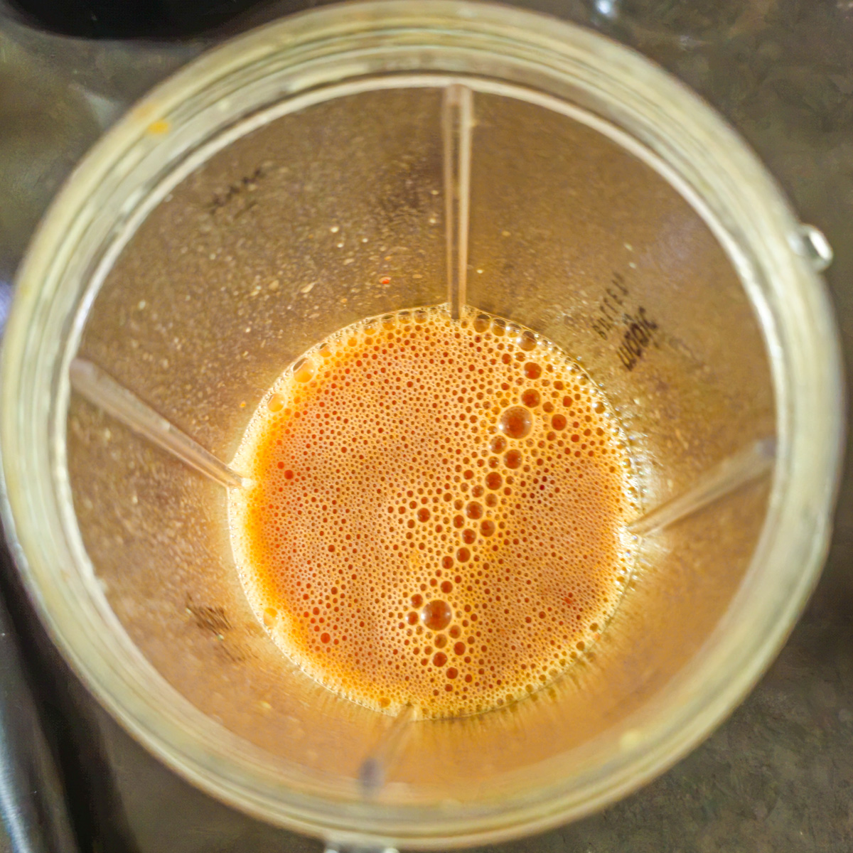 Clamato, chipotle, Worcestershire, citrus juice, and hot sauce are added to the miso michelada mix in the blender.