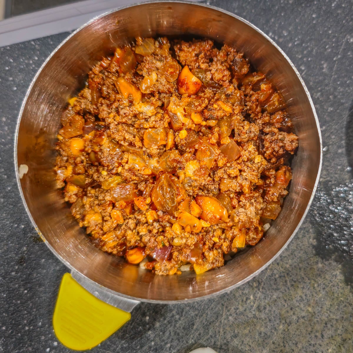 The seasoned ground meat mixture is added to the ring mold for the second layer.