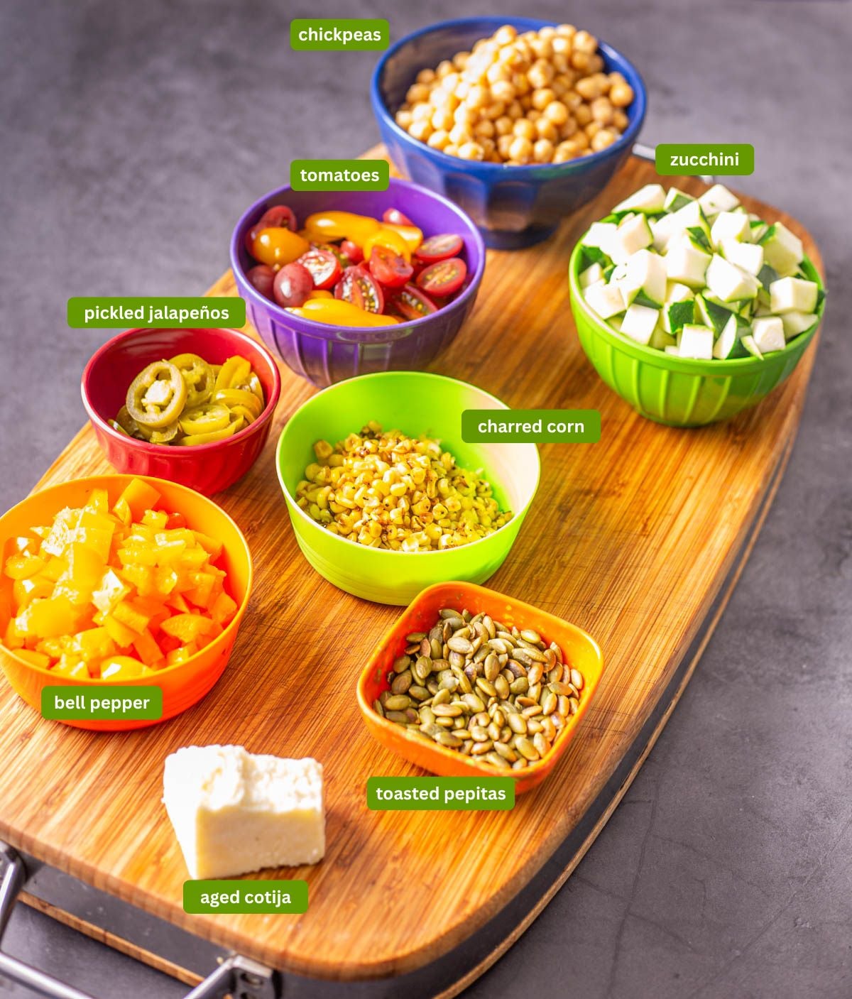 Ingredients for Mexican chickpea salad including charred corn, zucchini, and chickpeas.