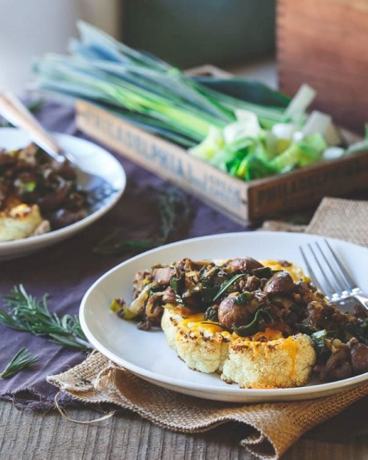 A cauliflower "steak" with a healthy ground bison and mushroom sauce.
